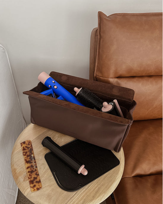 Louenhide Margot Hair Tool Case in brown vegan leather sits open with Dyson Airwrap inside
