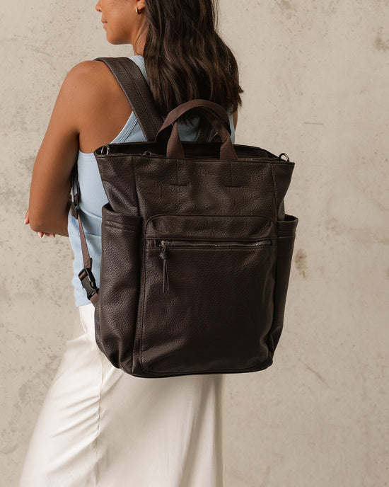 Louenhide Bronx Backpack in Chocolate, worn as a backpack for work commute