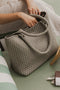 Sage Green Neoprene Cruiser Tote Sits on green pool chair